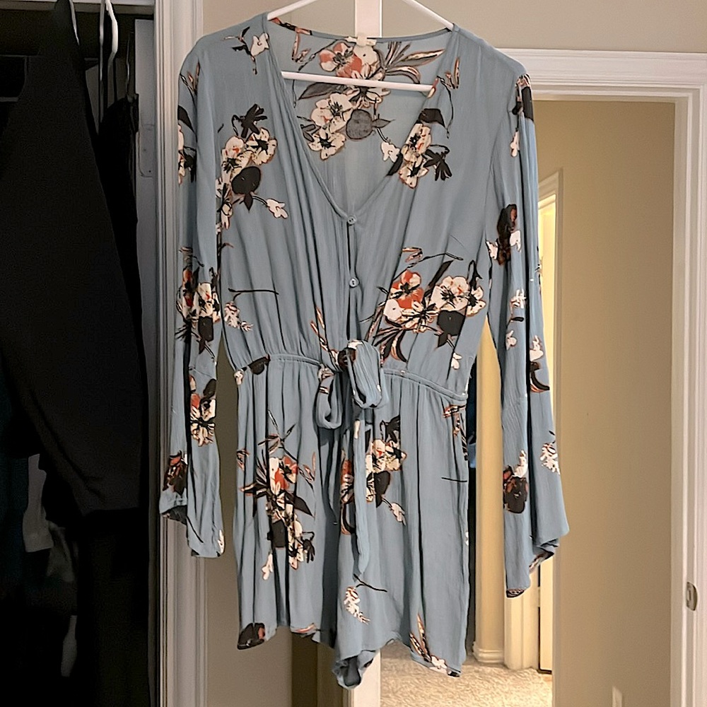 Floral Romper size L. Blue with flowers. Elastic waste bell sleeves.